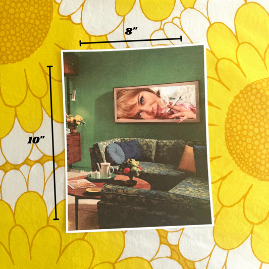 Vintage-style room decor with a framed picture of a woman on a green wall, surrounded by yellow floral patterns.