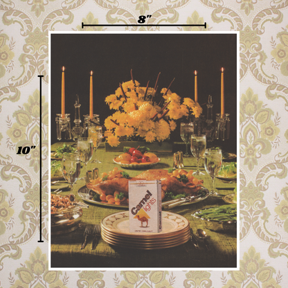 8x10 art print of a vintage-style dinner table with food and a pack of Camel Light cigarettes served on a vintage plate, framed with decorative borders and measurements.
