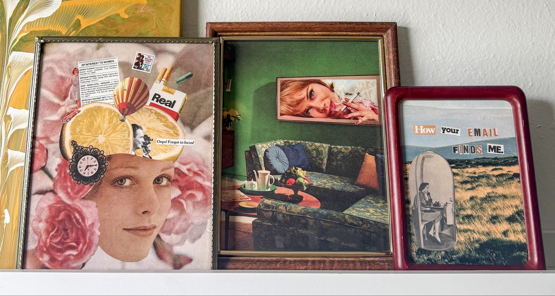 Three framed vintage-style collage prints displayed side-by-side on a white shelf against a textured white wall.